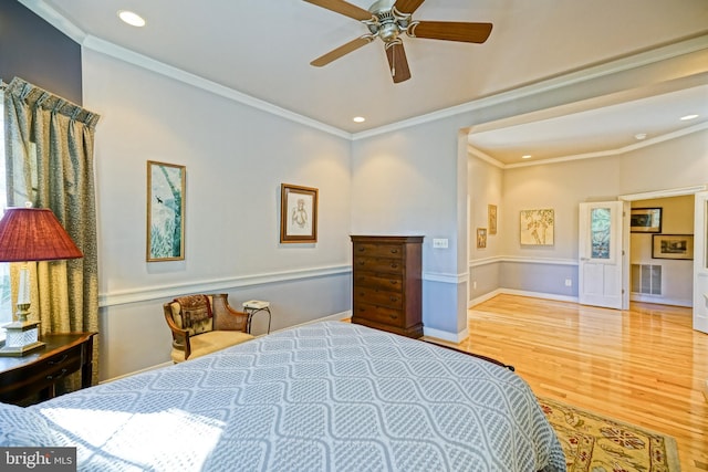 bedroom with ornamental molding, recessed lighting, visible vents, and wood finished floors