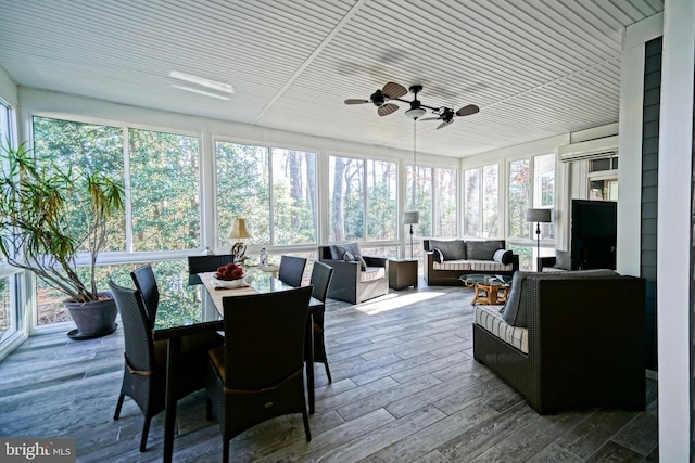 sunroom / solarium featuring ceiling fan