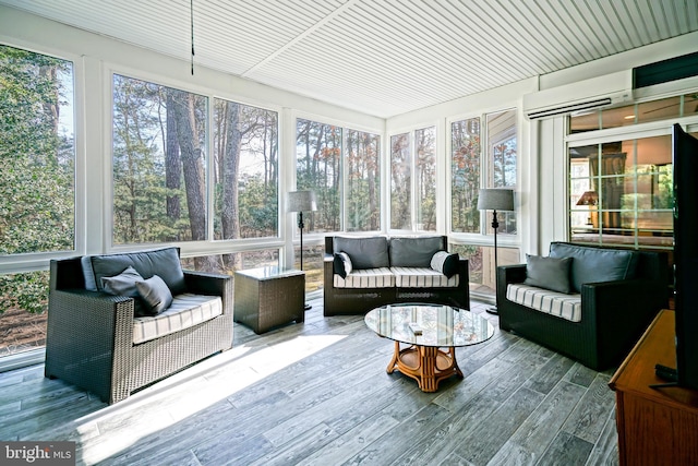 sunroom featuring a wall unit AC