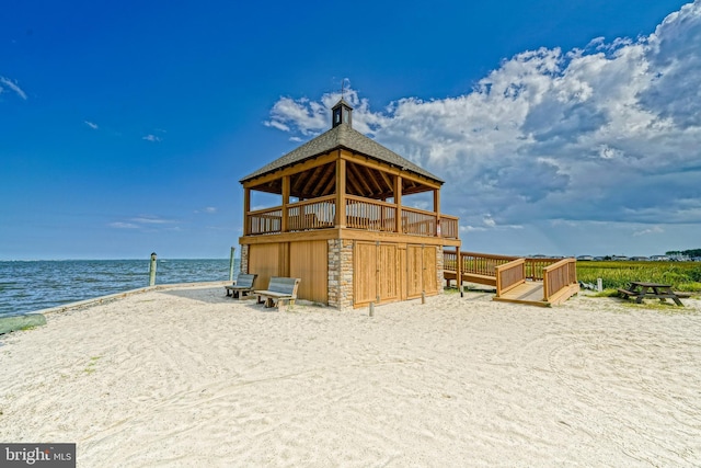 view of outbuilding with a water view