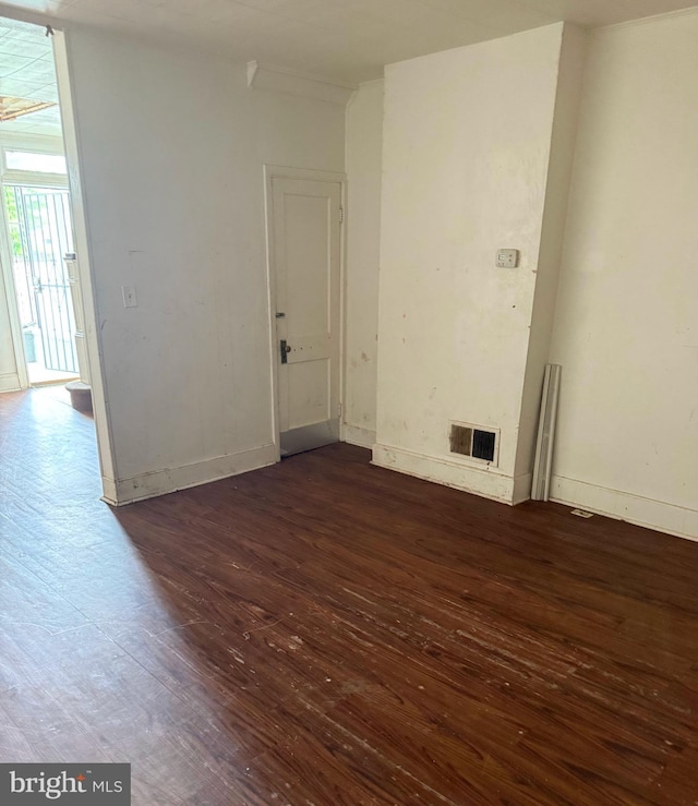 628 E Patapsco Ave, Baltimore, MD 21225 - spare room with wood-type flooring and baseboards