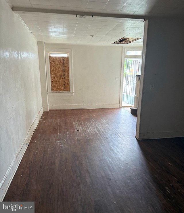 628 E Patapsco Ave, Baltimore, MD 21225 - empty room with wood finished floors and baseboards