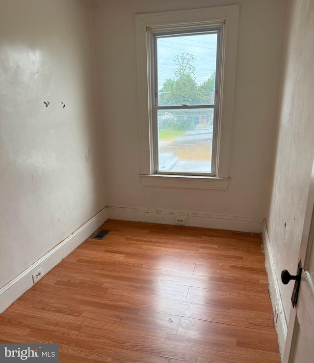 628 E Patapsco Ave, Baltimore, MD 21225 - spare room with light wood finished floors and baseboards