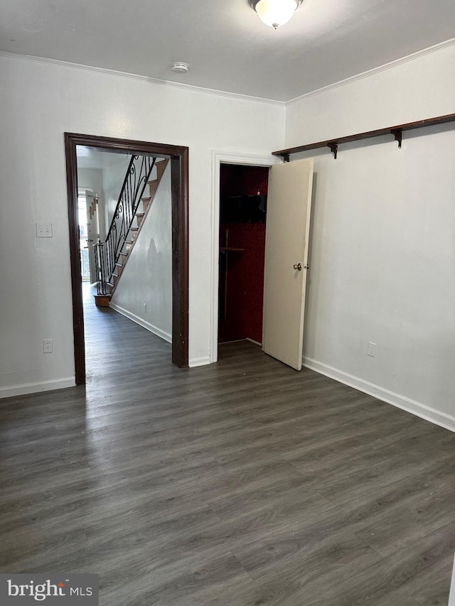 unfurnished room featuring dark hardwood / wood-style flooring