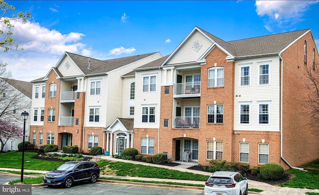 105 Sunshine Ct Unit F, Forest Hill, MD 21050 - view of front of home with brick siding and uncovered parking