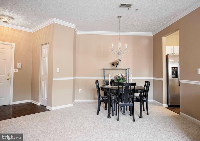 105 Sunshine Ct Unit F, Forest Hill, MD 21050 - dining space featuring a textured ceiling, visible vents, carpet flooring, baseboards, and a notable chandelier