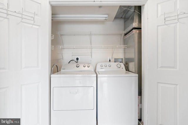 laundry area with laundry area and independent washer and dryer