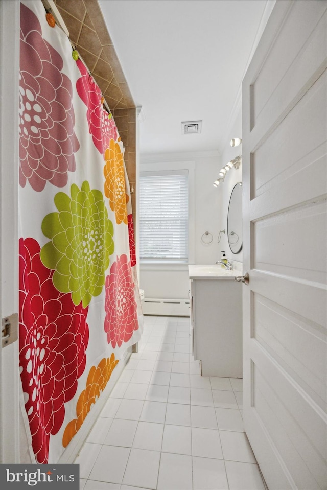 bathroom with a baseboard heating unit, vanity, ornamental molding, a shower with curtain, and tile patterned floors