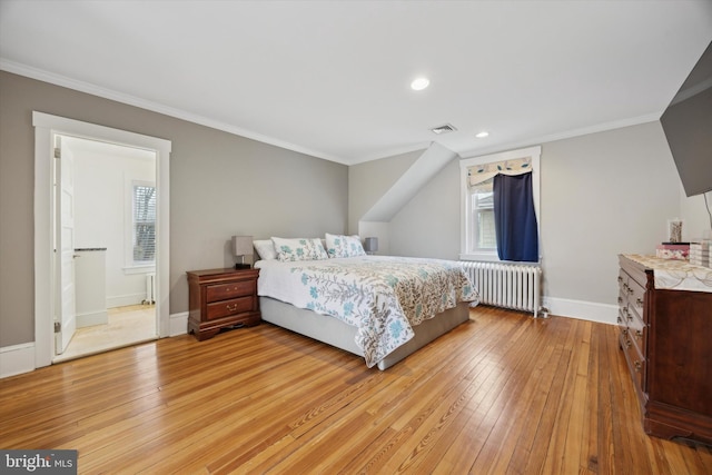 bedroom with crown molding, radiator, light hardwood / wood-style floors, and multiple windows