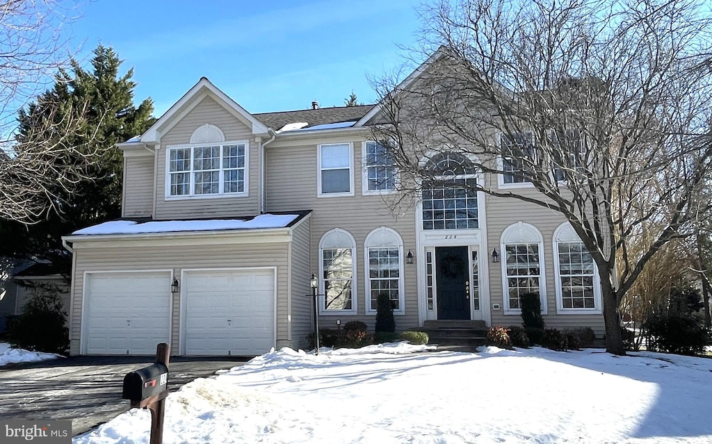 front facade with a garage