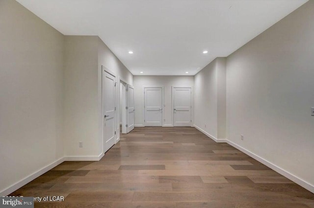 corridor with wood-type flooring