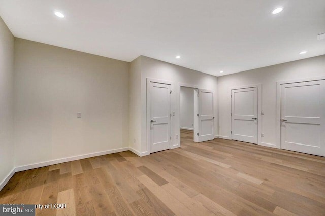 unfurnished bedroom featuring light wood-type flooring