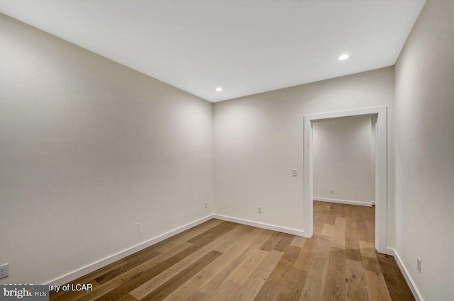 spare room featuring light hardwood / wood-style flooring