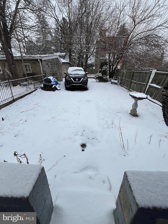 view of yard layered in snow