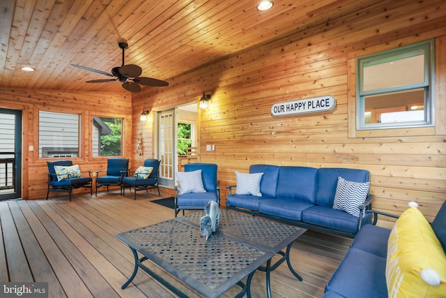 living room featuring vaulted ceiling, wooden ceiling, wooden walls, and wood-type flooring