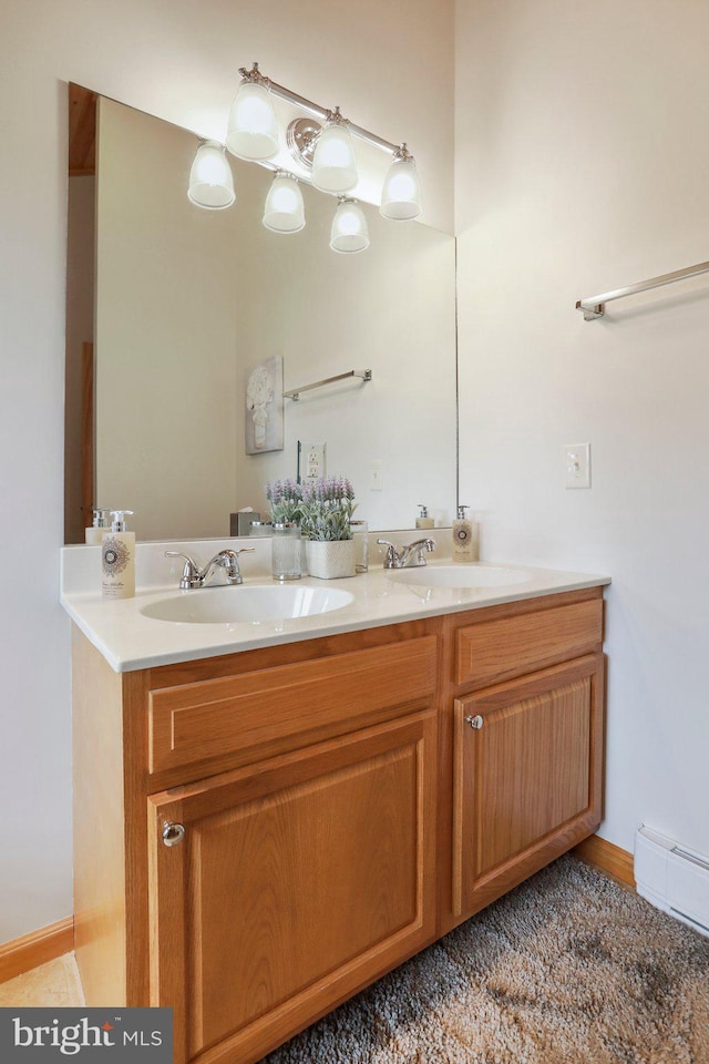 bathroom featuring vanity and baseboard heating