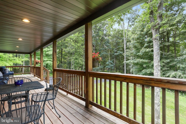 wooden deck with a yard