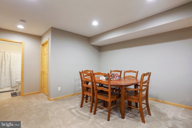 dining area with light carpet