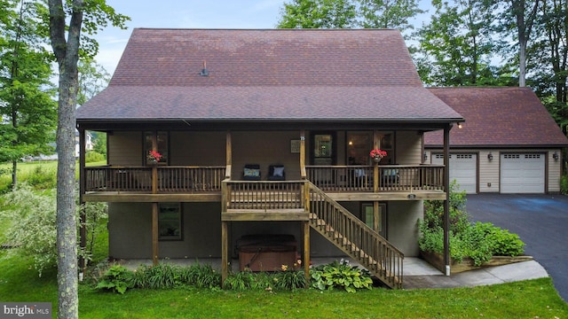 back of property with a garage