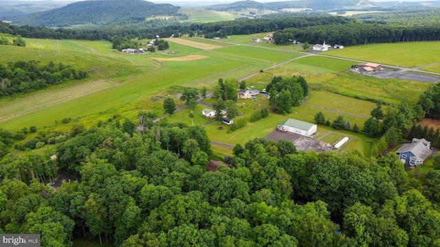 drone / aerial view with a mountain view and a rural view