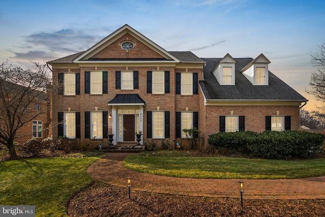 view of front of property with a lawn