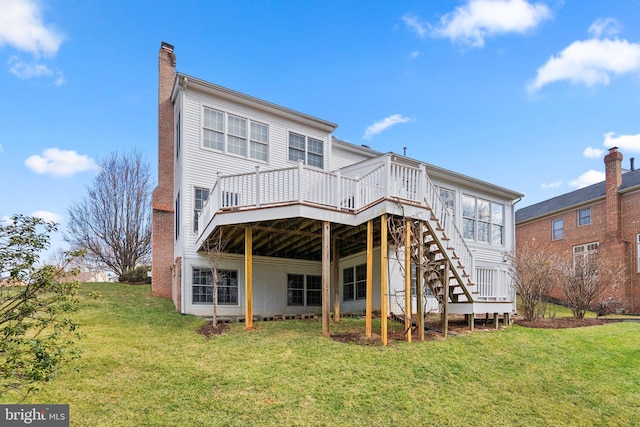 back of house featuring a yard and a deck