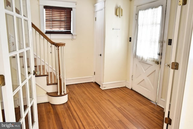 entryway with hardwood / wood-style flooring