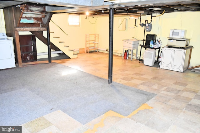 basement with washer / dryer and sink