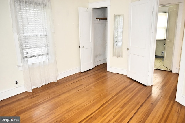 unfurnished bedroom with wood-type flooring