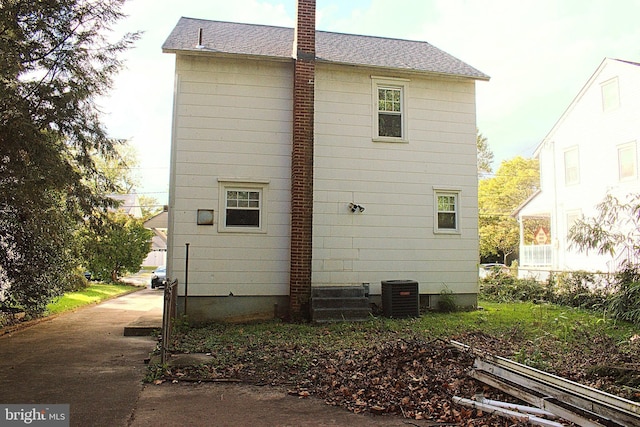 view of home's exterior with central AC