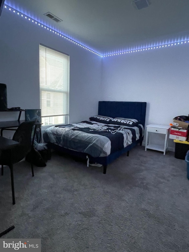 carpeted bedroom with visible vents