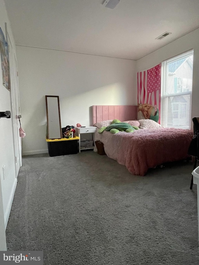 bedroom featuring visible vents and carpet floors