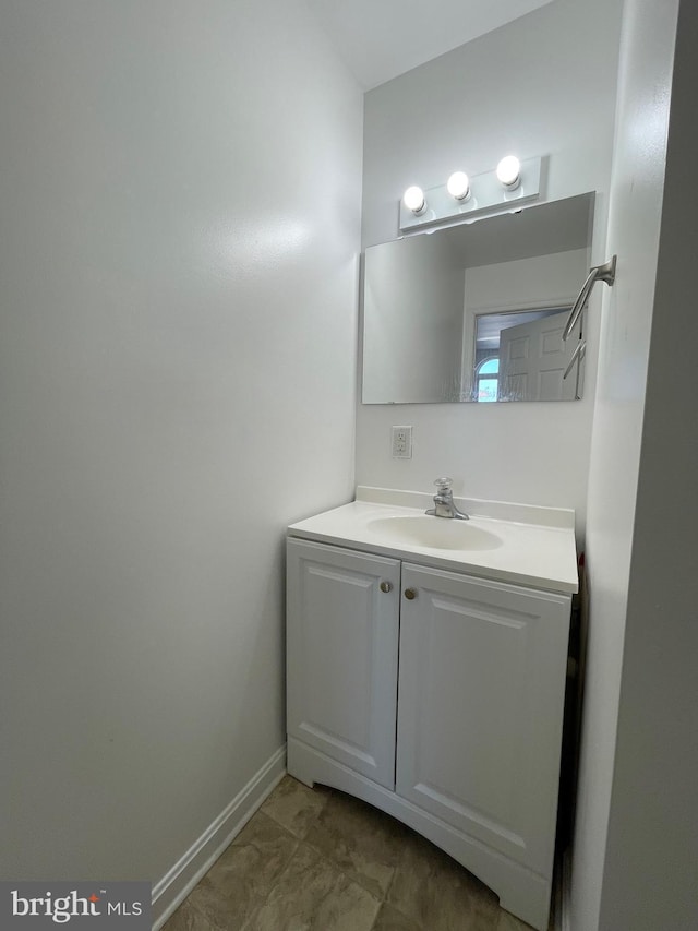 bathroom featuring vanity and baseboards