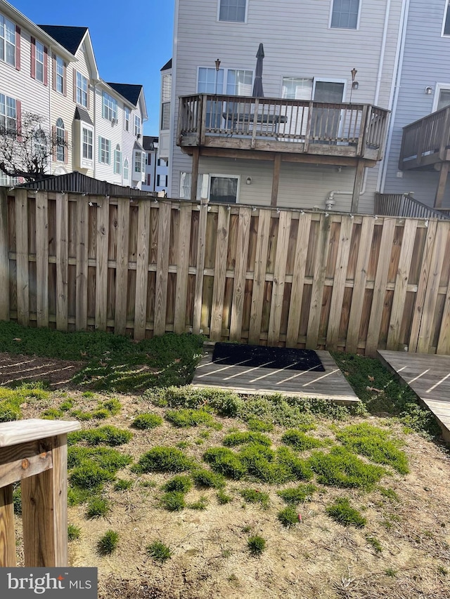 view of yard featuring a residential view and fence