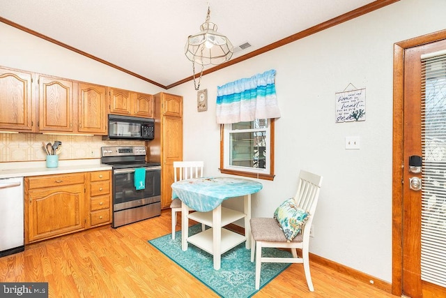 kitchen with pendant lighting, white dishwasher, stainless steel range with electric cooktop, and light wood-type flooring