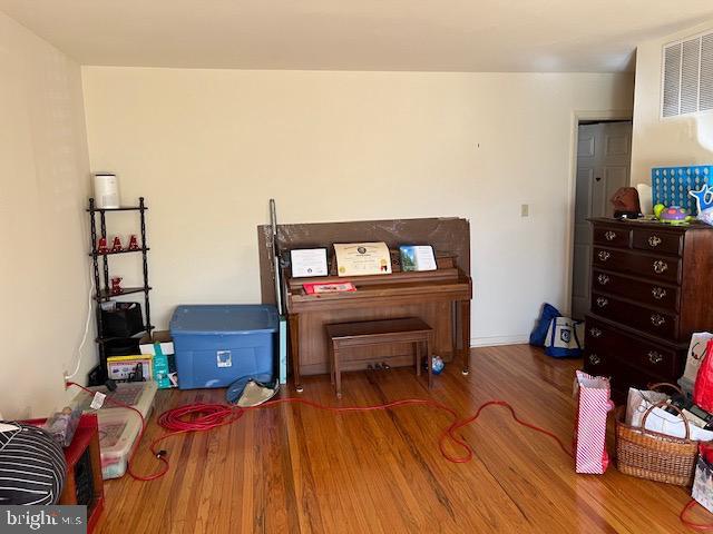 interior space featuring visible vents and wood finished floors