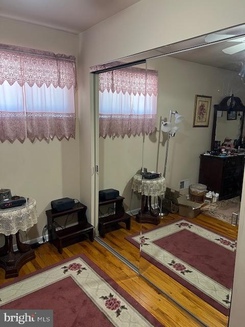 bedroom with visible vents and wood finished floors