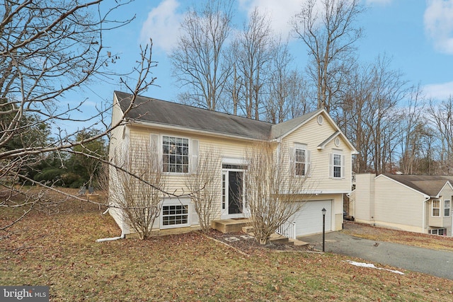 view of front of property with a garage and driveway