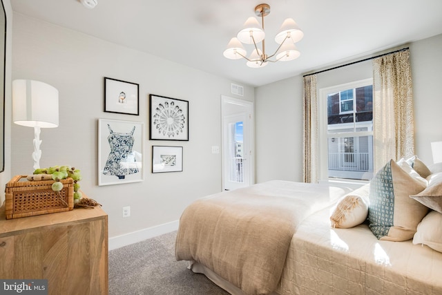 bedroom featuring a chandelier and carpet flooring