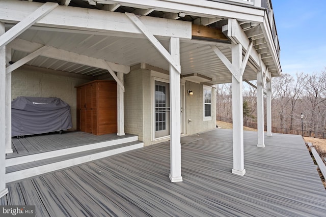 wooden deck with grilling area