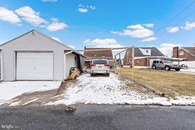 view of front of house featuring a garage and a lawn