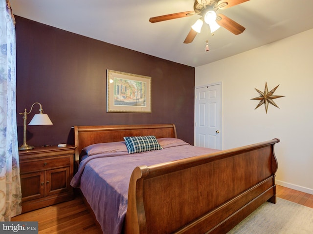 bedroom featuring ceiling fan and light hardwood / wood-style floors