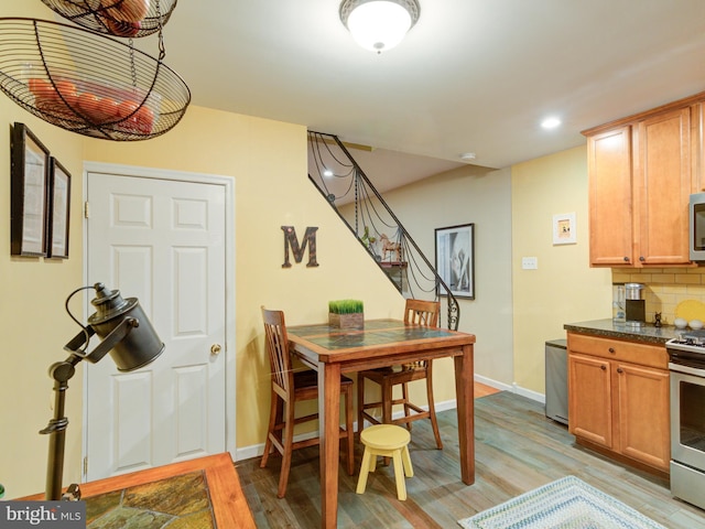 dining space featuring light hardwood / wood-style floors