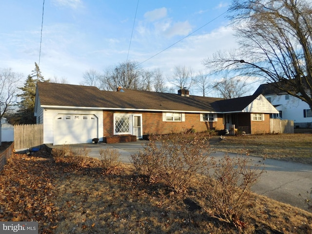 ranch-style house featuring a garage