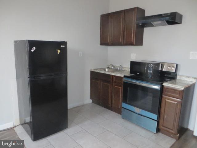 kitchen featuring black fridge, dark brown cabinets, sink, and stainless steel range with electric cooktop