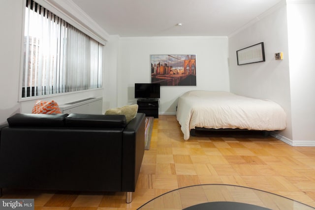 bedroom featuring parquet flooring and ornamental molding