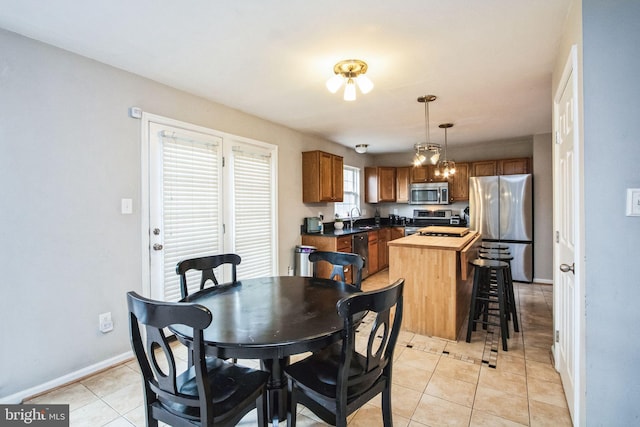 tiled dining area with sink