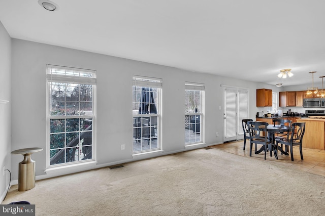 view of carpeted dining area