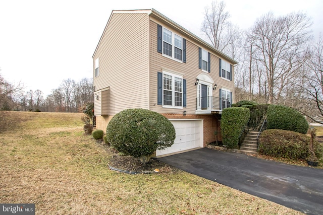 view of front of property with a garage and a front yard