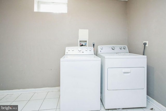 washroom with washer and dryer